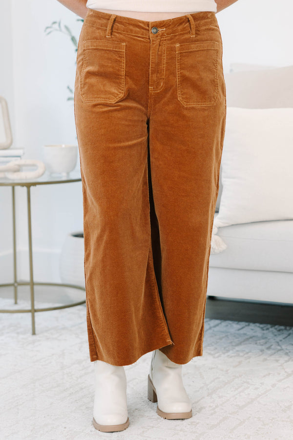 Plus Size brown corduroy wide-leg pants with front patch pockets and a raw hem.
