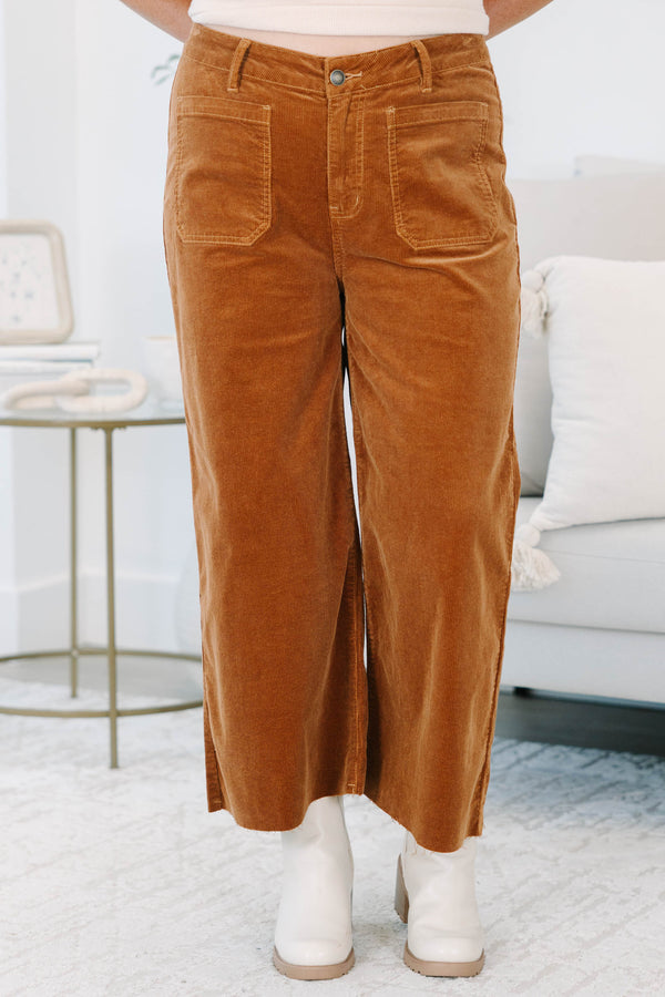 Plus Size brown corduroy wide-leg pants with front patch pockets and a raw hem.