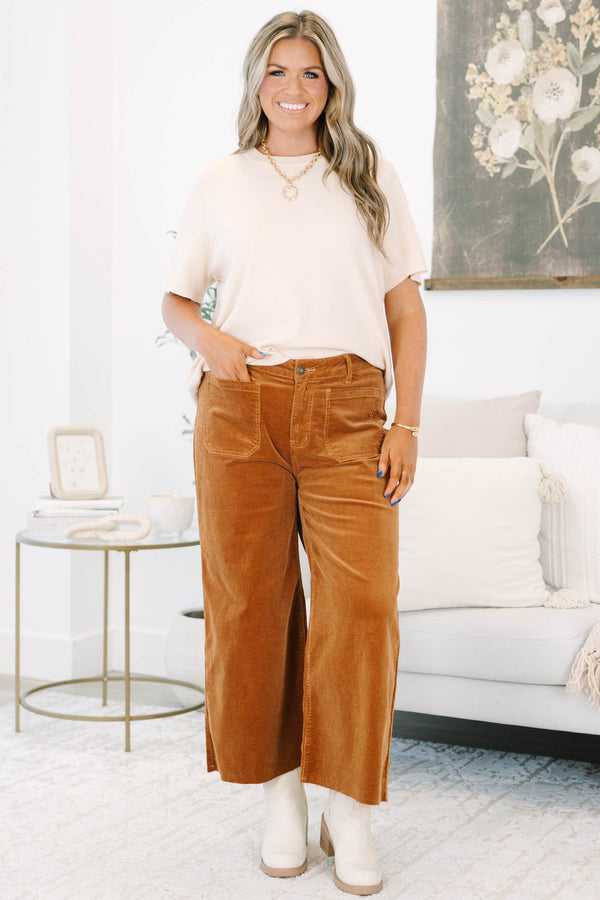 Plus Size brown corduroy wide-leg pants with front patch pockets and a raw hem.