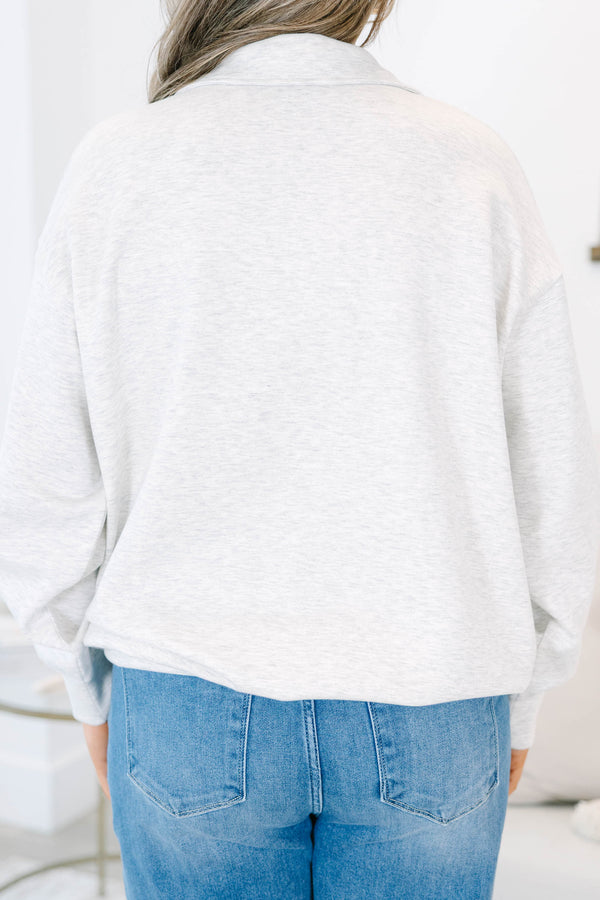 Plus Size light gray heather pullover with a relaxed fit, v-neck collar, and long sleeves.