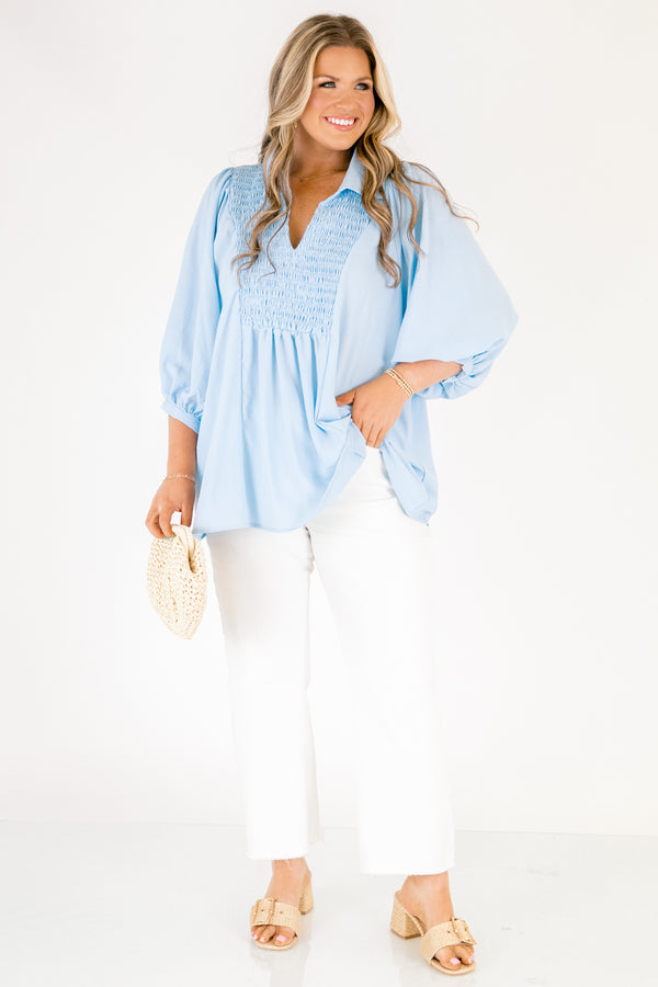 Plus Size light blue airflow top with smocked bust, collared V-neckline, and quarter sleeves.