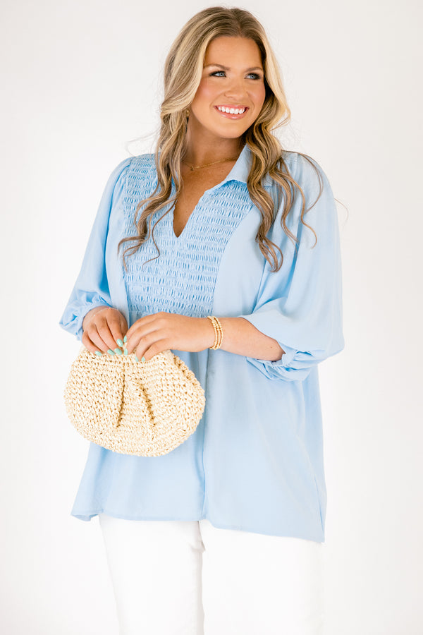 Plus Size light blue airflow top with smocked bust, collared V-neckline, and quarter sleeves.