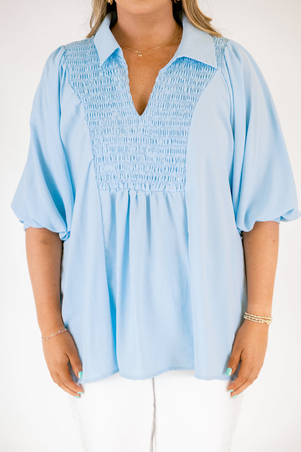 Plus Size light blue airflow top with smocked bust, collared V-neckline, and quarter sleeves.