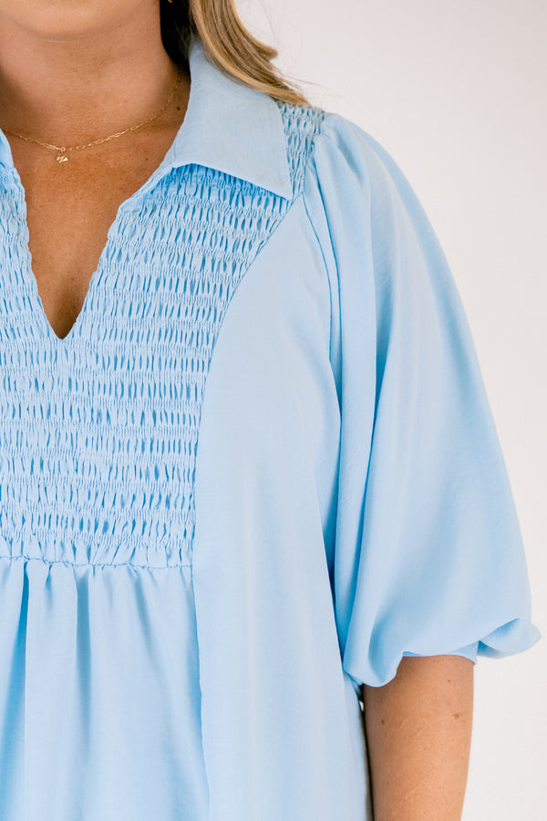Plus Size light blue airflow top with smocked bust, collared V-neckline, and quarter sleeves.