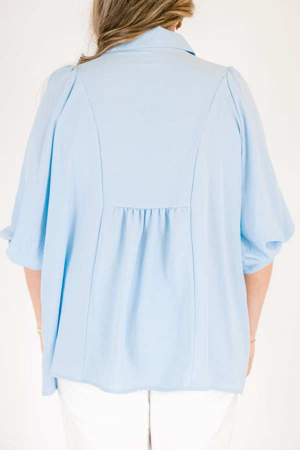 Plus Size light blue airflow top with smocked bust, collared V-neckline, and quarter sleeves.