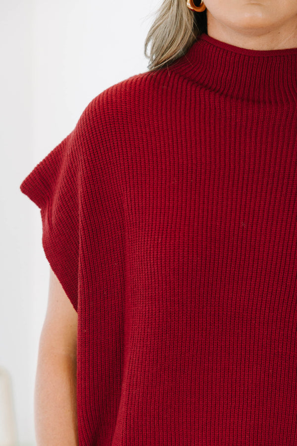Plus size wine red mock neck sweater with cap sleeves and a relaxed knit fit.