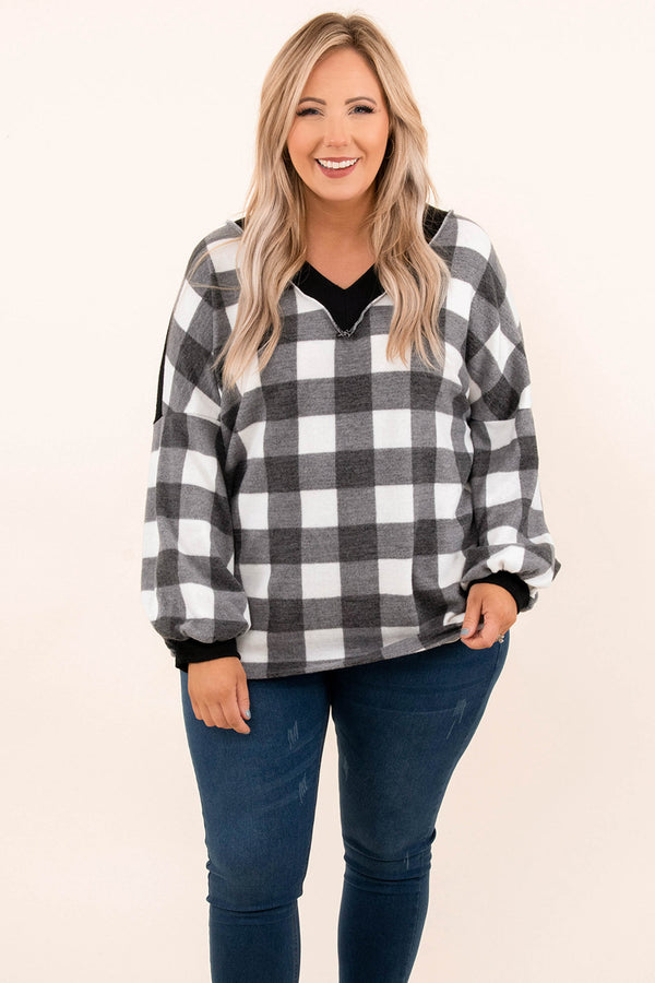 Plus Size ivory and black buffalo plaid top with a V-neckline and long balloon sleeves.