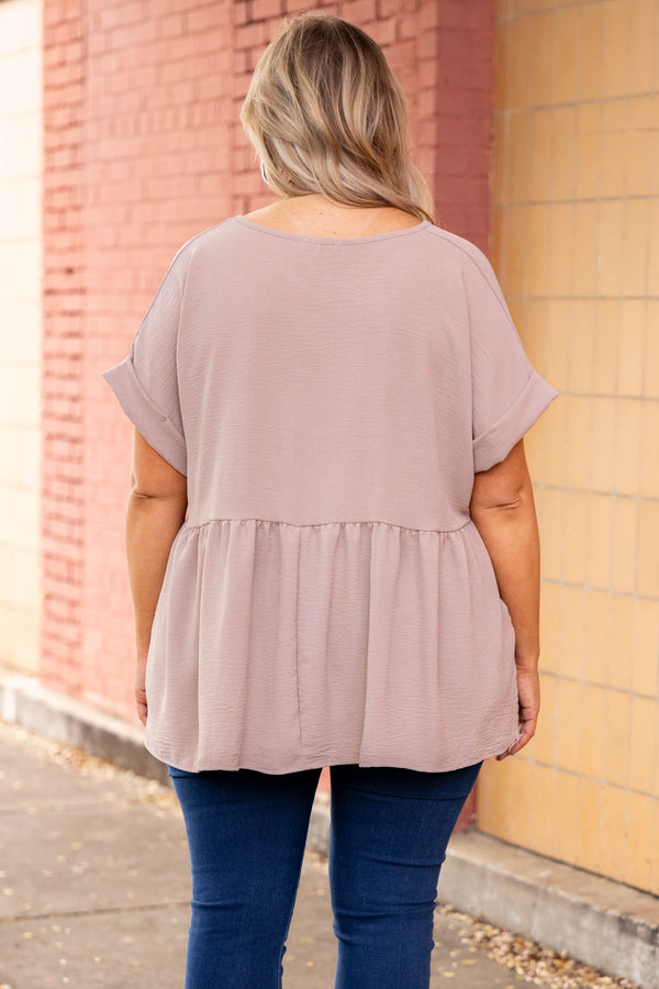 Plus Size toast-colored babydoll top with a V-neckline, cuffed short sleeves, and a tiered hem.