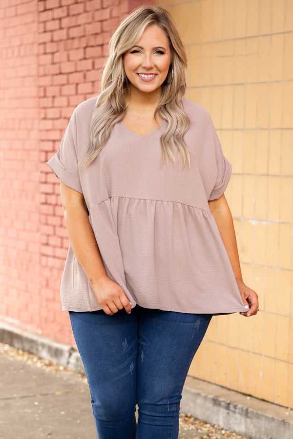 Plus Size toast-colored babydoll top with a V-neckline, cuffed short sleeves, and a tiered hem.
