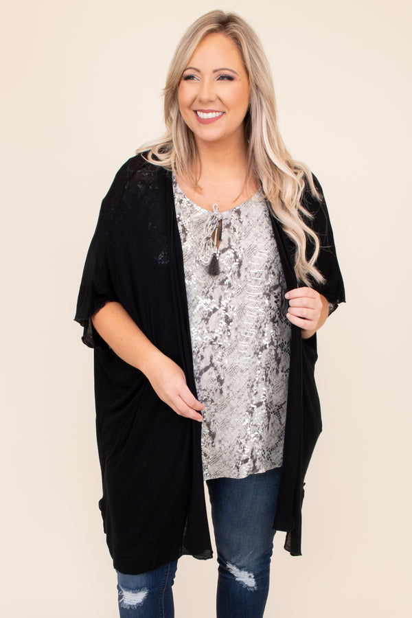 Plus Size black open-front kimono with an oversized fit and short sleeves over a snakeskin top.