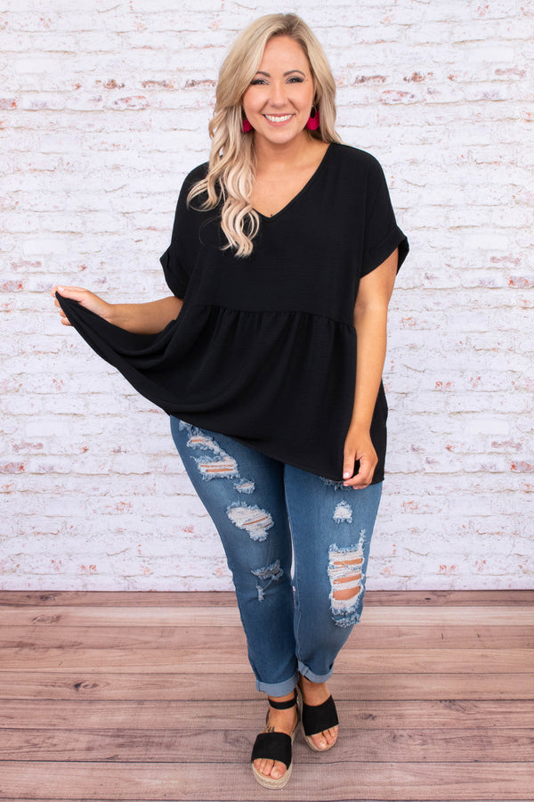Plus Size black babydoll top with a v-neckline, cuffed short sleeves, and a flowy tiered hem.