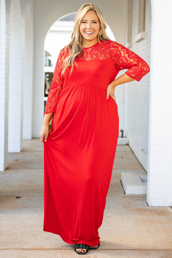 Plus Size red maxi dress with a fitted bodice, long lace sleeves, and a flowing floor-length skirt.