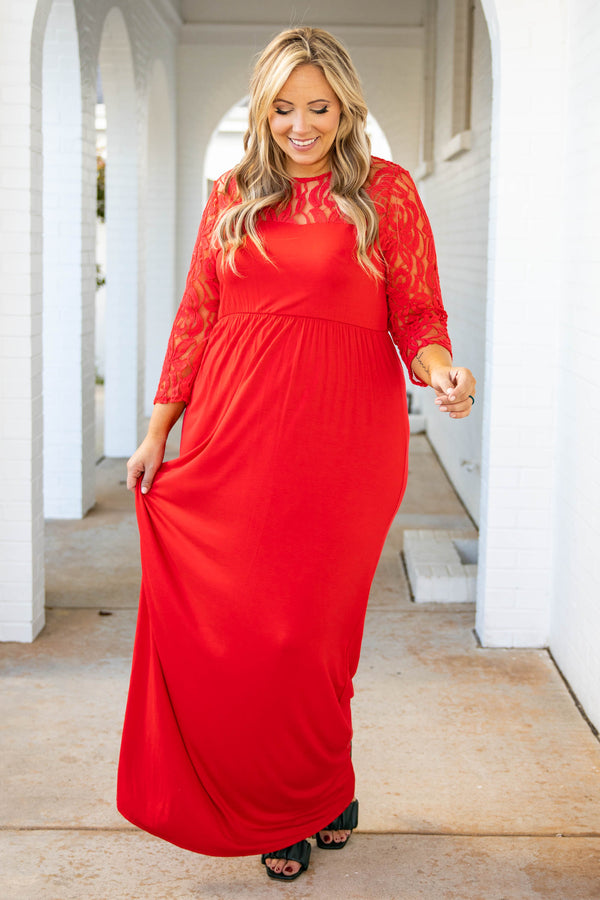 Plus Size red maxi dress with a fitted bodice, long lace sleeves, and a flowing floor-length skirt.
