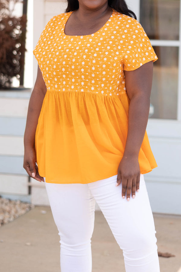 Chic Soul plus size clothing, orange babydoll style top with flower patterned bodice