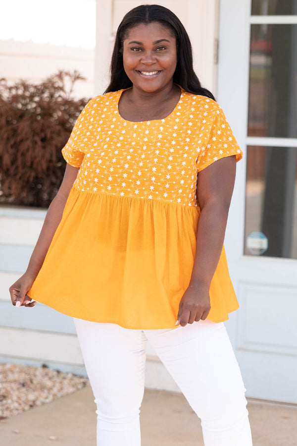Chic Soul plus size clothing, orange babydoll style top with flower patterned bodice