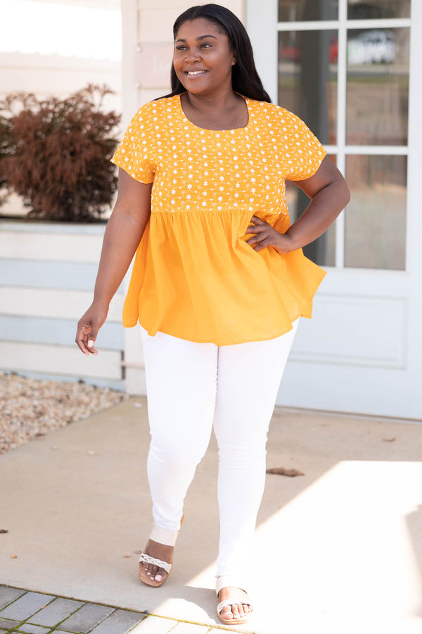 Chic Soul plus size clothing, orange babydoll style top with flower patterned bodice