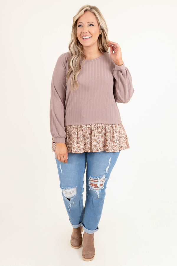 Plus Size light blue distressed jeans with a stretchy fit and cuffed hems.