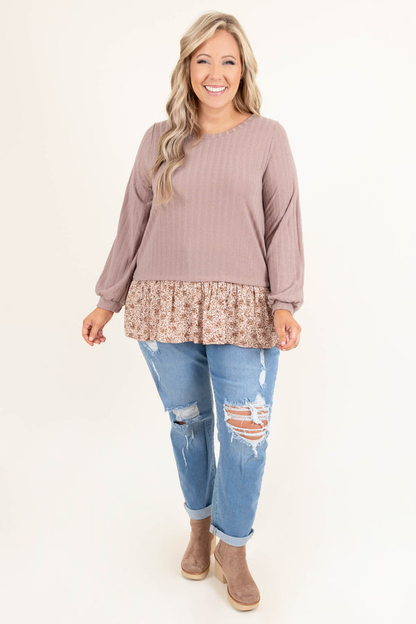 Plus Size light blue distressed jeans with a stretchy fit and cuffed hems.
