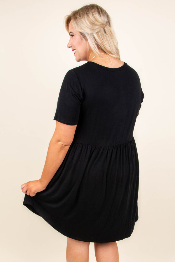 Plus Size black babydoll dress with short sleeves, a round neckline, and a breezy rayon-spandex fit.